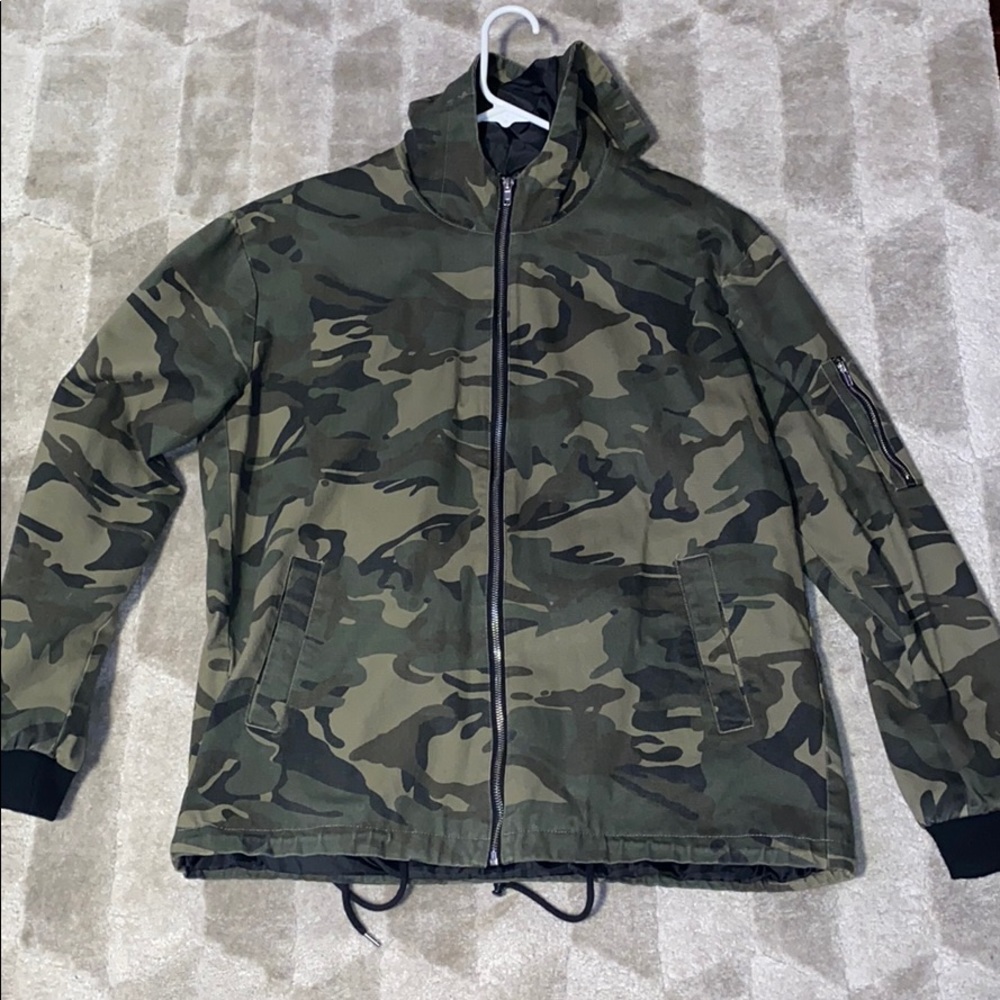 Camo zip trench with jaw string bottom.